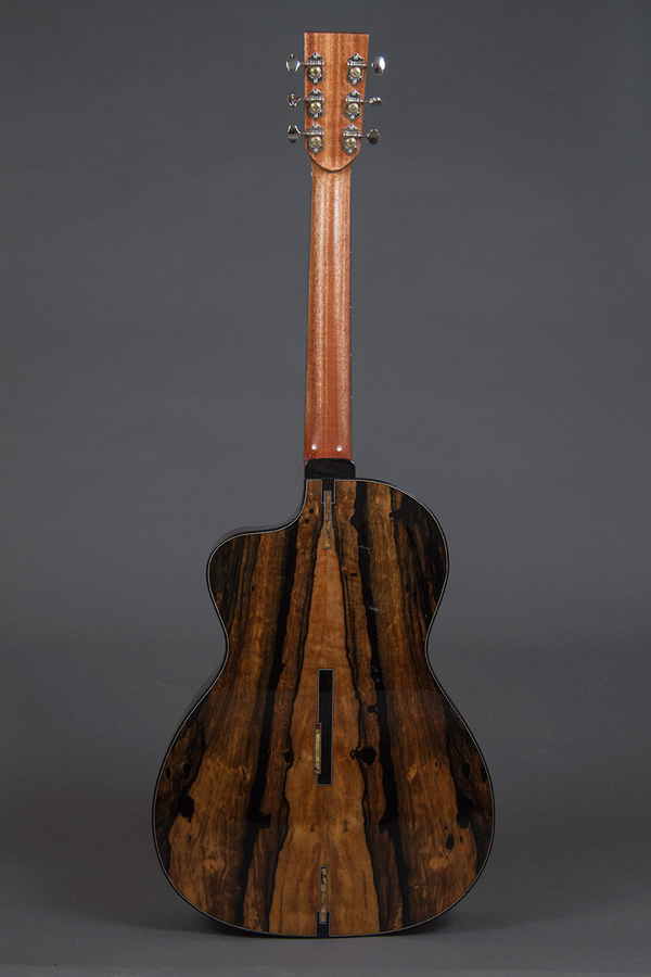 Matinheikki Instruments - Modern acoustic guitar 
behind